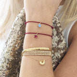 Model wears two Birthstone Star Friendship Bracelets
