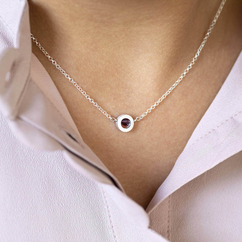 Image shows model wearing Brushed Silver Circle Birthstone Necklace