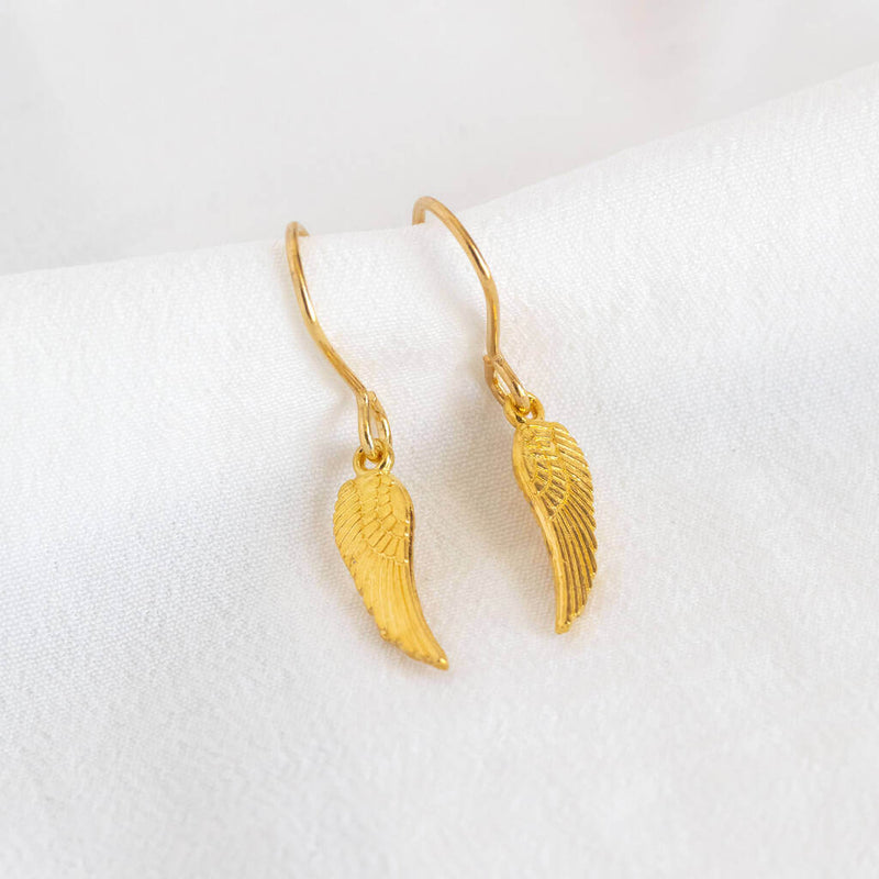 Image shows  dainty gold angel wing earrings