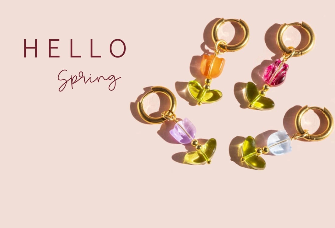Image shows colourful glass tulip earrings on a pink background with the words Hello Spring