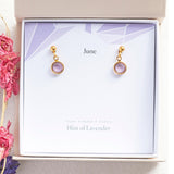 Image shows gold June Birthstone Swarovski Crystal Drop Earrings in a gift boson a June birthstone charactaristic card