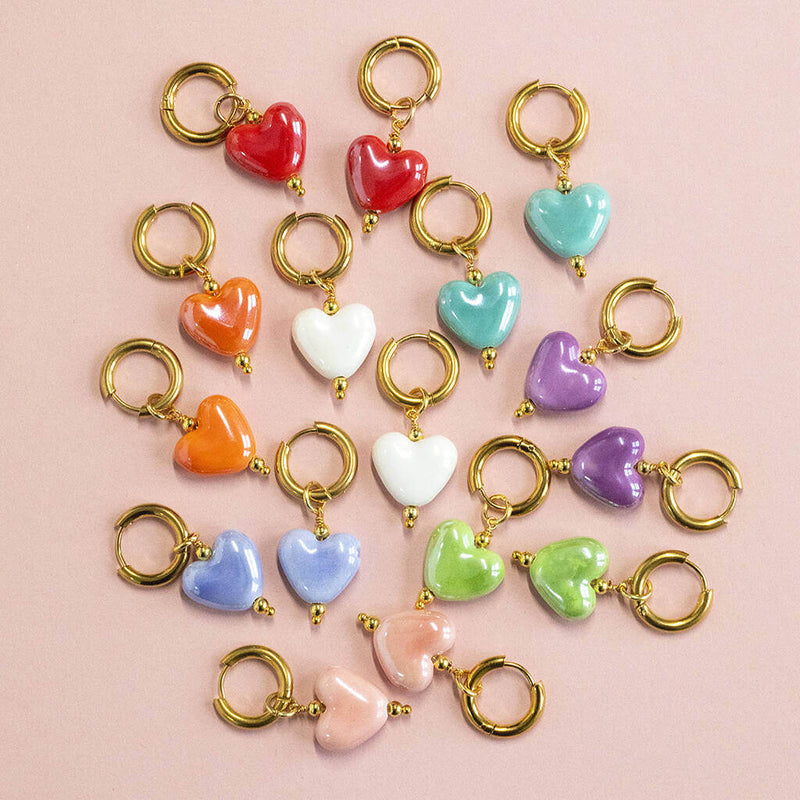 Images shows colourful Mix and Match Glazed Heart Huggie Hoop Earrings
