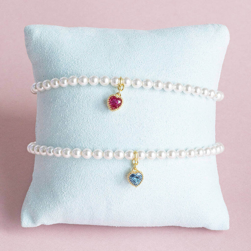 Image shows two Pearl Bracelet with Heart Birthstone Charm with July and March birthstone