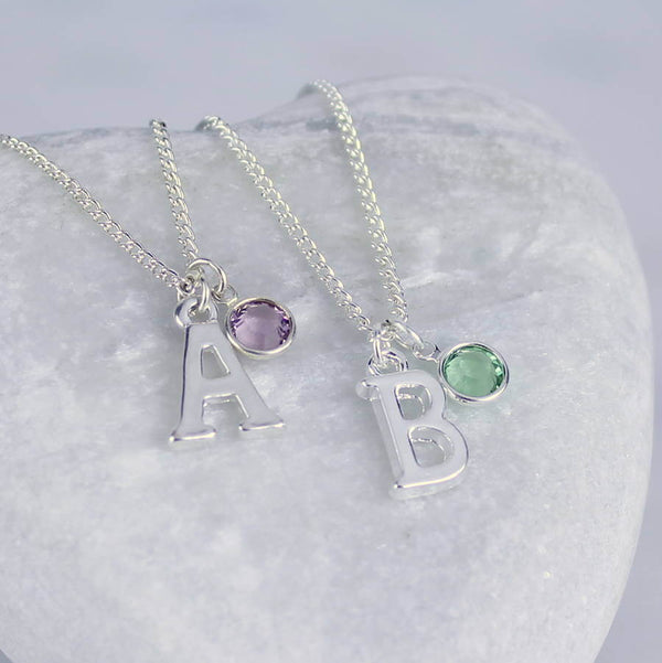 Image shows two personalised birthstone charm necklaces