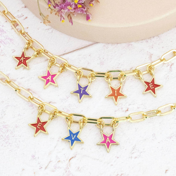 Image shows two Personalised Name in Stars Charm Bracelet with the name Katie and Eva