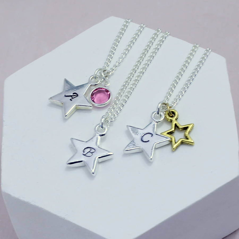 Image shows selection of personalised star charm necklaces