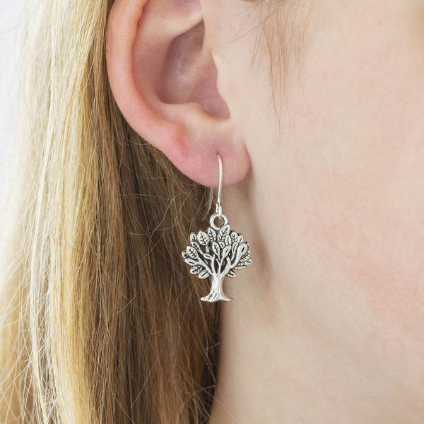 Image shows model wearing Tree of Life Earrings