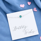 image shows sterling silver birthstone bracelet on a card that says birthday wishes on a blue background with pink hearts