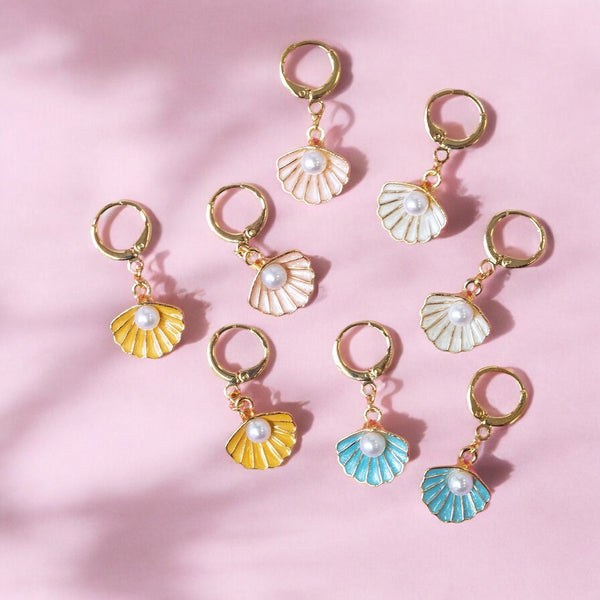 image shows enamel shell earrings in cream yellow pink and blue colour ways