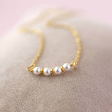 Image shows gold 40th birthday dainty pearl bar necklace