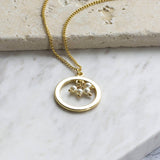 Image shows 40th birthday gold circle pearl necklace