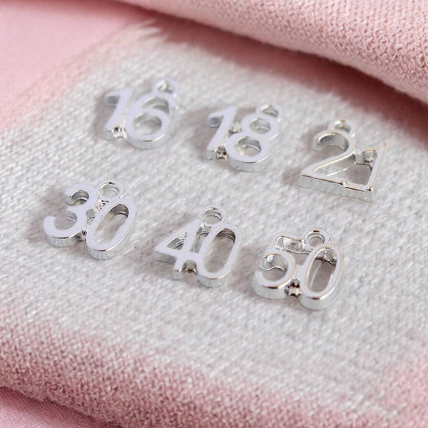 images shows number charms for a special birthday personalised charm bracelet