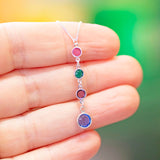 Close-up of a sterling silver Mother and Three Children Birthstone Pendant Necklace featuring four colourful birthstones in a vertical drop design.