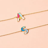 Colourful enamel initial bracelets with gold plated A and S letter charms on delicate chains