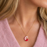 Pink enamel personalised initial necklace with C letter pendant worn on a delicate gold chain