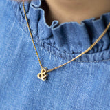 Image shows model wearing Ampersand Symbol Hidden Meaning Necklace