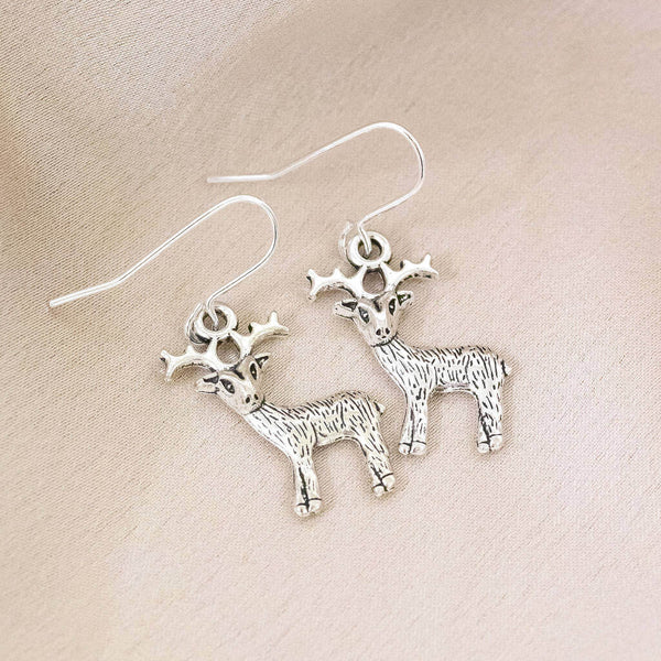 Image shows antique effect Christmas reindeer earrings