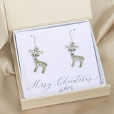 Image shows antique effect Christmas reindeer  earrings in a gift box on a Merry Christmas sentiment card