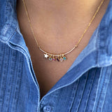 Image shows model wearing Bar Charm Necklace With Star And Family Birthstones