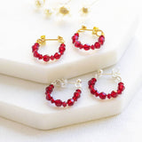 Image shows Beaded Birthstone Huggie Earrings gold and  silver 