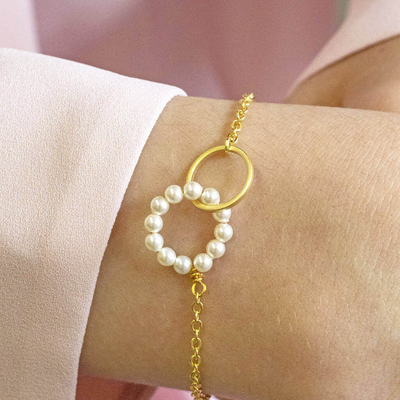 Model wears beaded pearl eternity bracelet