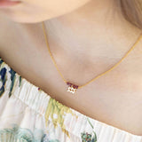 Image shows model wearing Birthstone Bar Necklace with Zodiac Charm Detail 