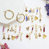 Image shows birthstone hoop earrings with all charms