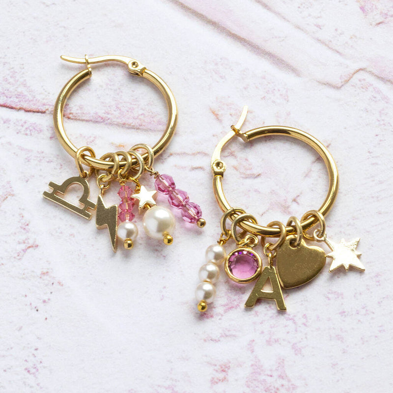 Image shows birthstone hoop earrings with multiple charms