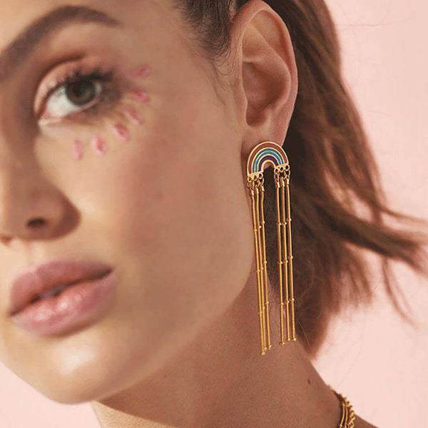 Image shows model wearing boho rainbow earrings with long chain drop