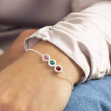 Images shows model wearing brushed circles family birthstone bracelet