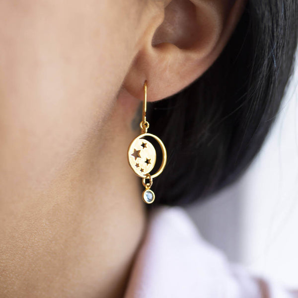 Image shows model wearing gold Celestial Birthstone Earring