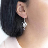 Image shows model wearing silver Celestial Birthstone Earring