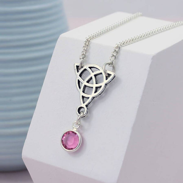 Image shows Celtic knot birthstone necklace with October birthstone