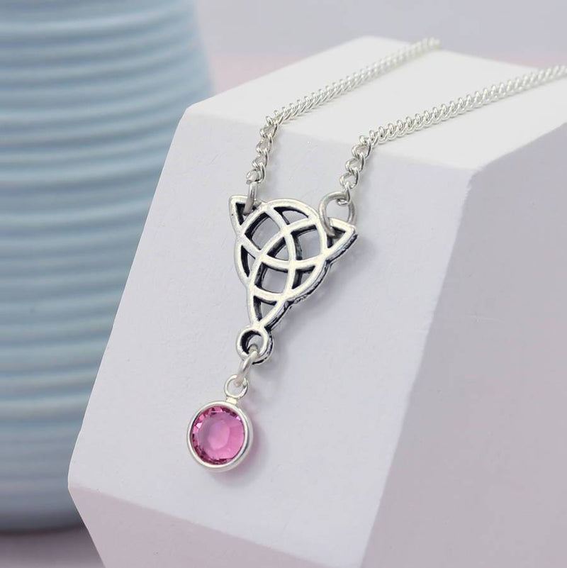 Image shows Celtic knot birthstone necklace with October birthstone