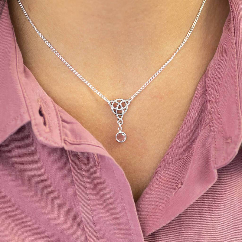 Image shows model wearing Celtic knot birthstone necklace