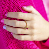 Image shows model wearing chain slider ring with July heart birthstone charm