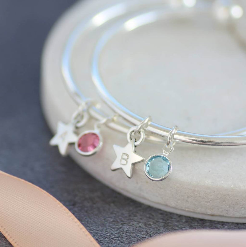 Image shows 2 Childs personalised star birthstone bangles