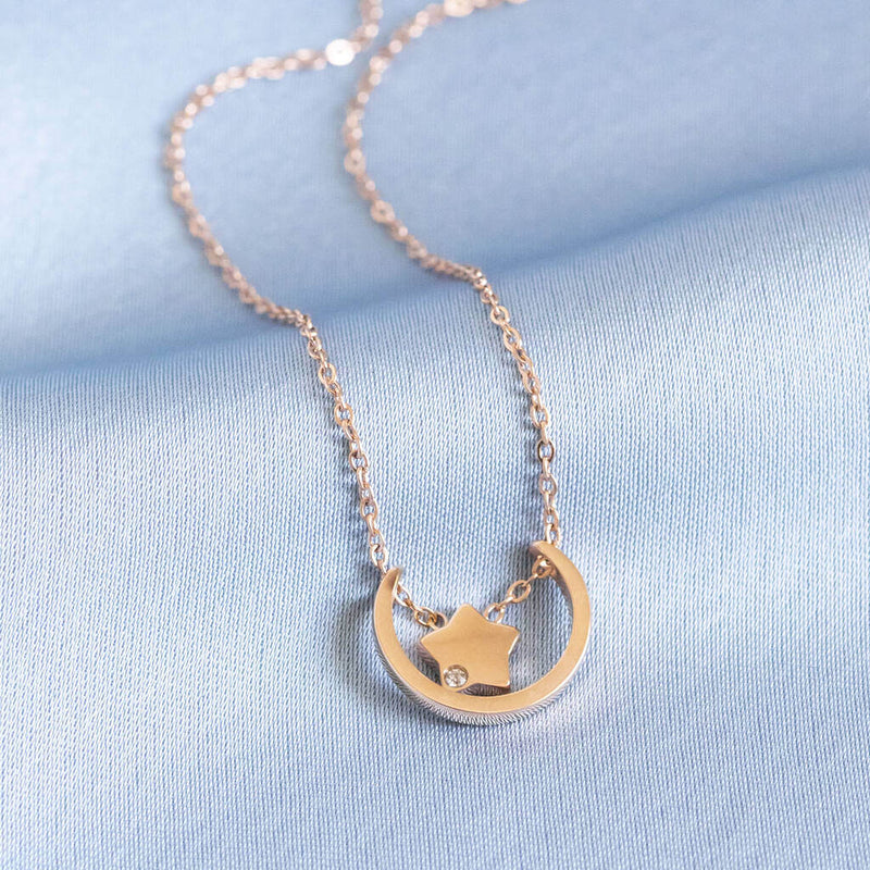 Image shows Contemporary Moon And Star Floating Necklace