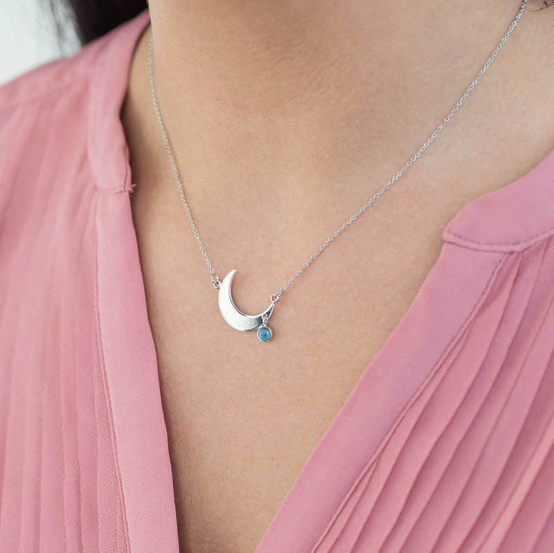 Image shows model wearing Crescent Moon Necklace With Mood Stone