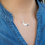 Image shows model wearing Crescent Moon Necklace With Mood Stone  Edit alt text