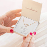 Image shows model holding gift box with Crystal Outline Heart Bracelet on a with love sentiment card