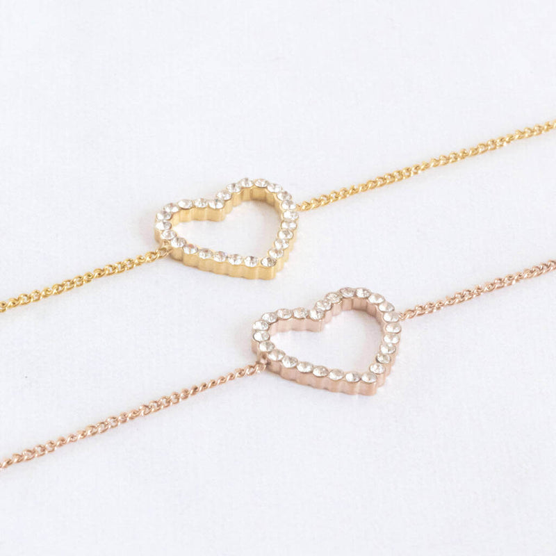 Image shows a gold and rose gold Crystal Outline Heart Bracelet