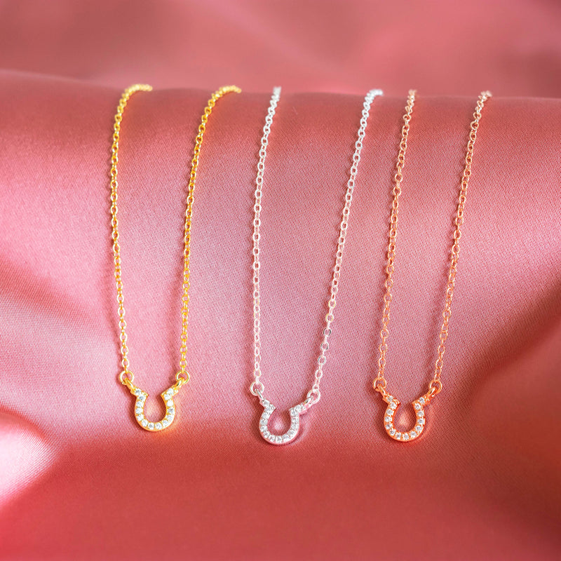 Image shows gold, silver and rose gold Crystal Pave Lucky Horseshoe Necklace