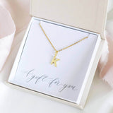 Image shows Dainty Gold Plated Initial Necklace with K initial in a gift box on a gift for you sentiment card