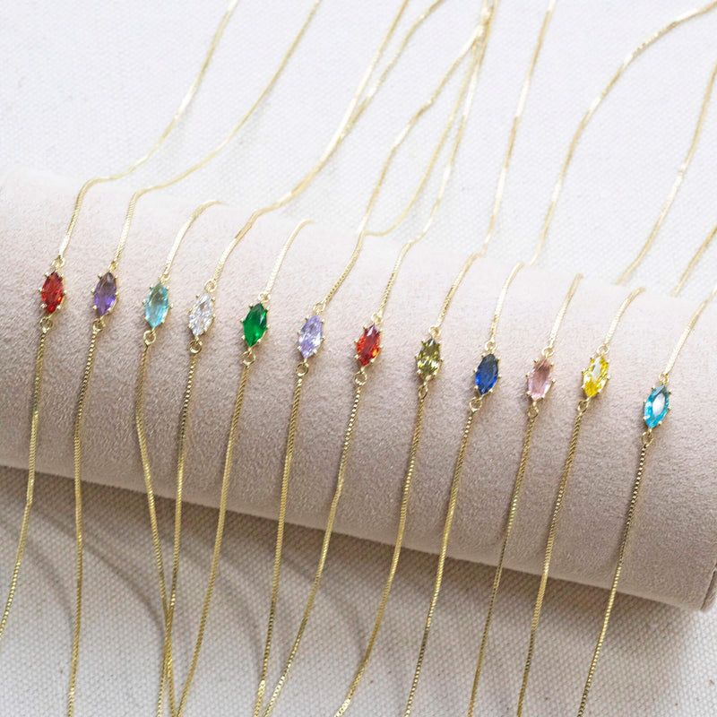 Image shows all dainty gold plated navette birthstone necklaces