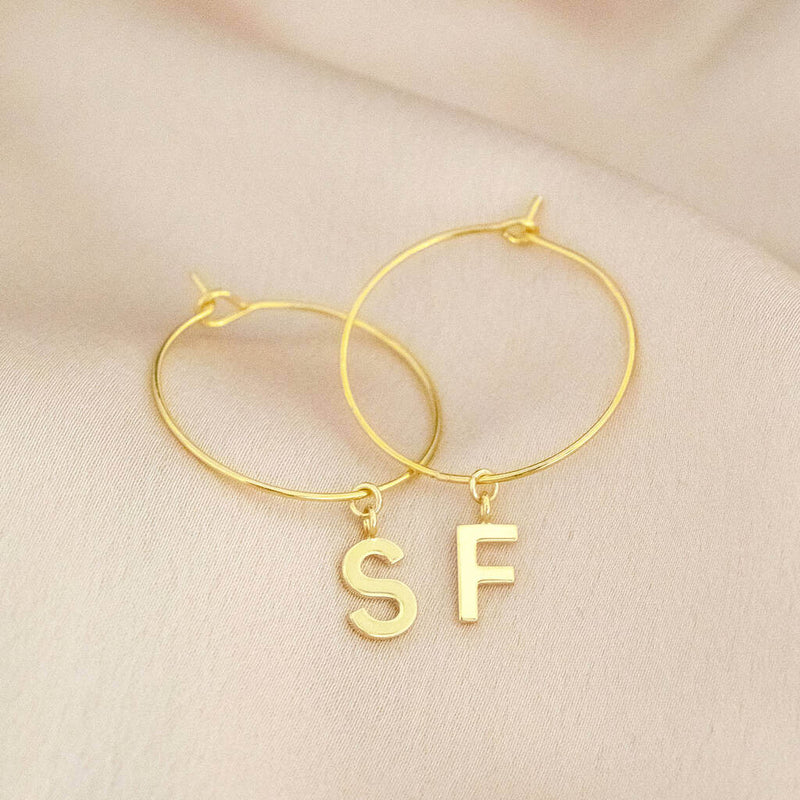 Image shows Dainty Initial Charm Hoop Earrings with initials S and F