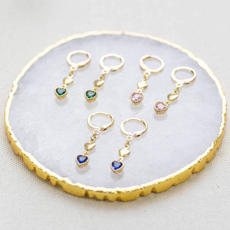 Image shows a selection of Double Heart Birthstone Huggie Hoop Earrings