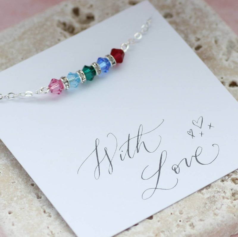 Image shows  family birthstone bar bracelet  on a with love sentiment card