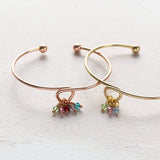 Image shows rose gold and gold  family birthstone charm bangle
