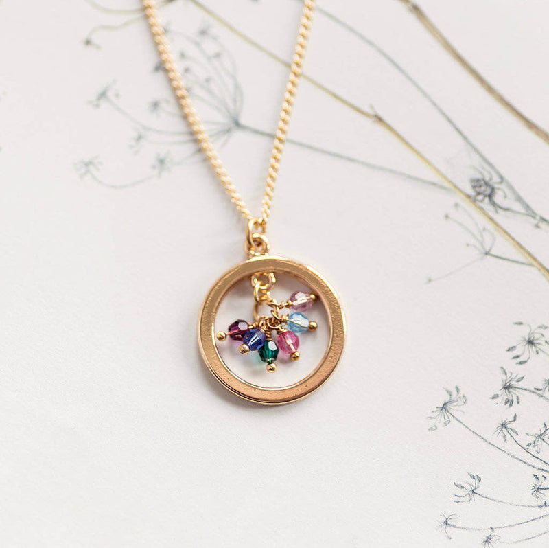 Image shows family birthstone halo necklace